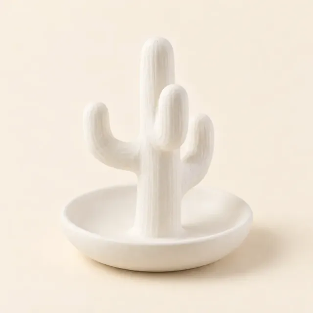 Unpainted white ceramic ring holder: a cactus standing in a small round dish